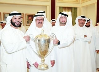 Hamdan bin Rashid Receives the Cup Champion